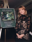 Jane Seymour poses before poster of her monet painting in Grand Hotel