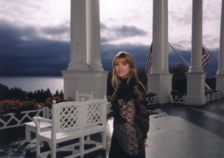 Jane Seymour poses at dusk on the porch of the Grand Hotel on Mackinac Island